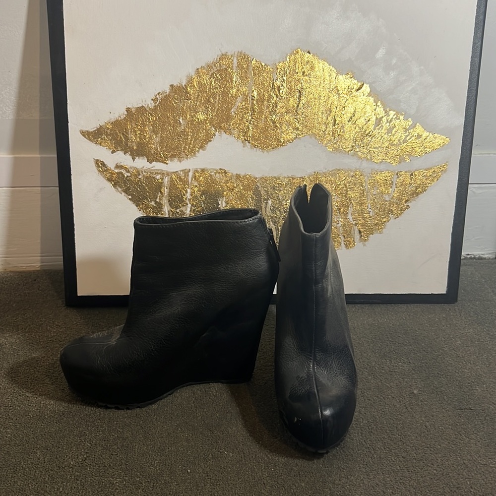 Wrapped Leather wedge booties with zipper detail on heel